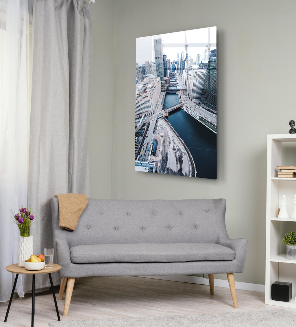 Snowy City River Aerial View Glass Wall Art on the wall