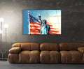 Statue of Liberty and American Flag Glass Wall Art in a living room interior
