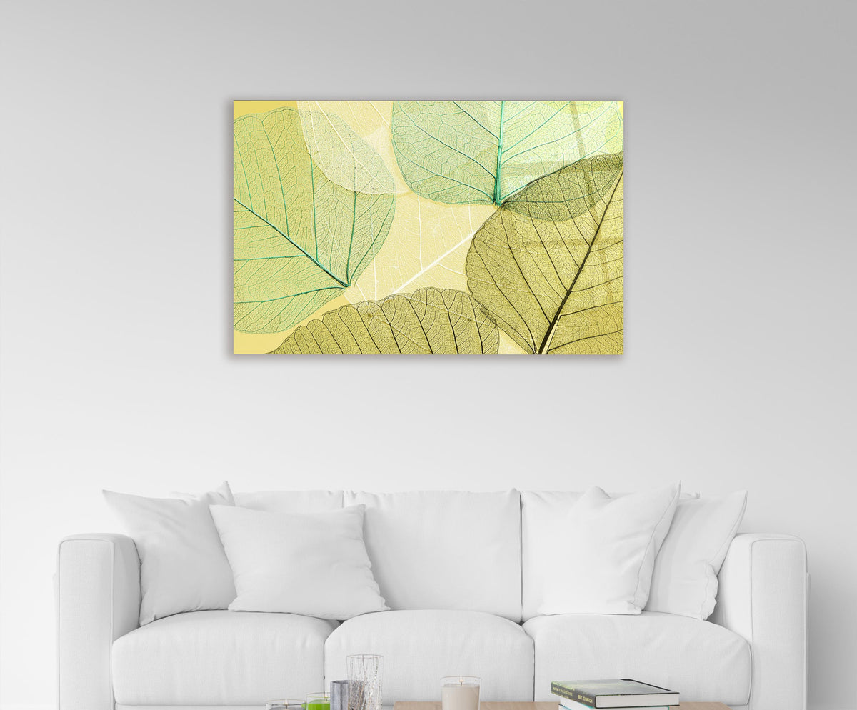 Green Skeleton Leaves Glass Wall Art in a living room interior