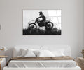 Motocross Rider Ink Splash Glass Wall Art in a living room interior
