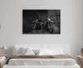 Black and White Motocross Riders Glass Wall Art in a living room interior