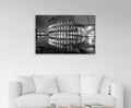 Colosseum at Night Black and White Glass Wall Art in a living room interior