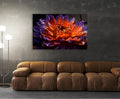 Fiery Orange Dahlia Macro Glass Wall Art in a living room interior