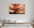 Blush Lily Petal Macro Glass Wall Art in a living room interior