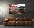 Japanese Pagoda with Cherry Blossoms Glass Wall Art in a living room interior