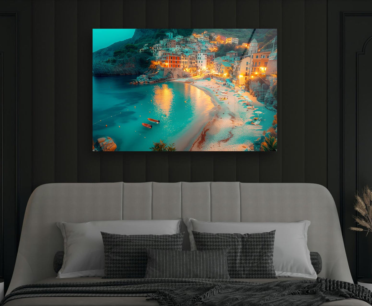 Coastal Village Beach at Dusk Glass Wall Art in a modern interior