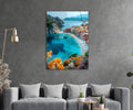 Mediterranean Cliffside Village Bay Glass Wall Art in a living room interior