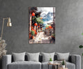 Mountain Village Lantern Alley Watercolor Glass Wall Art in a living room interior