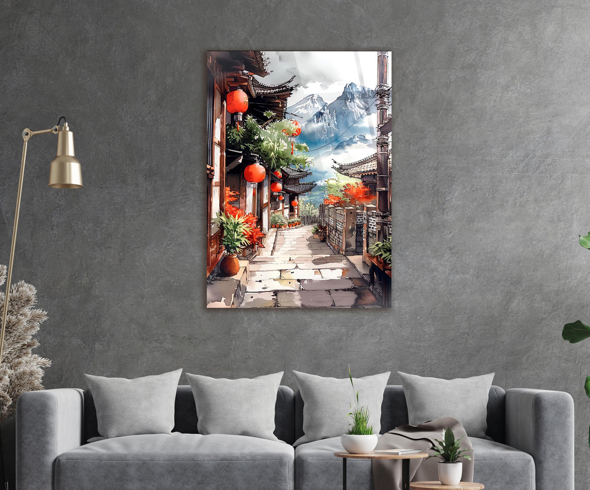 Mountain Village Lantern Alley Watercolor Glass Wall Art in a living room interior
