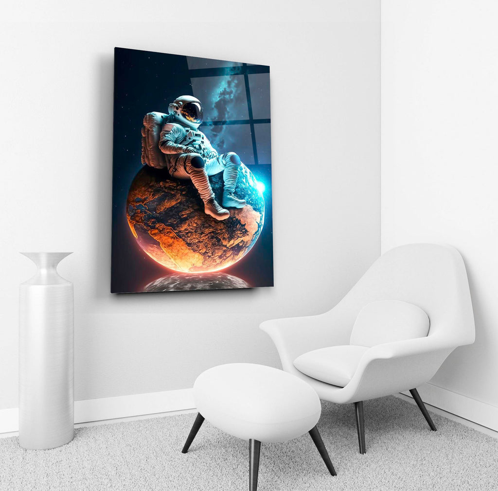 Astronaut Resting on a Glowing Planet Glass Wall Art in a living room interior