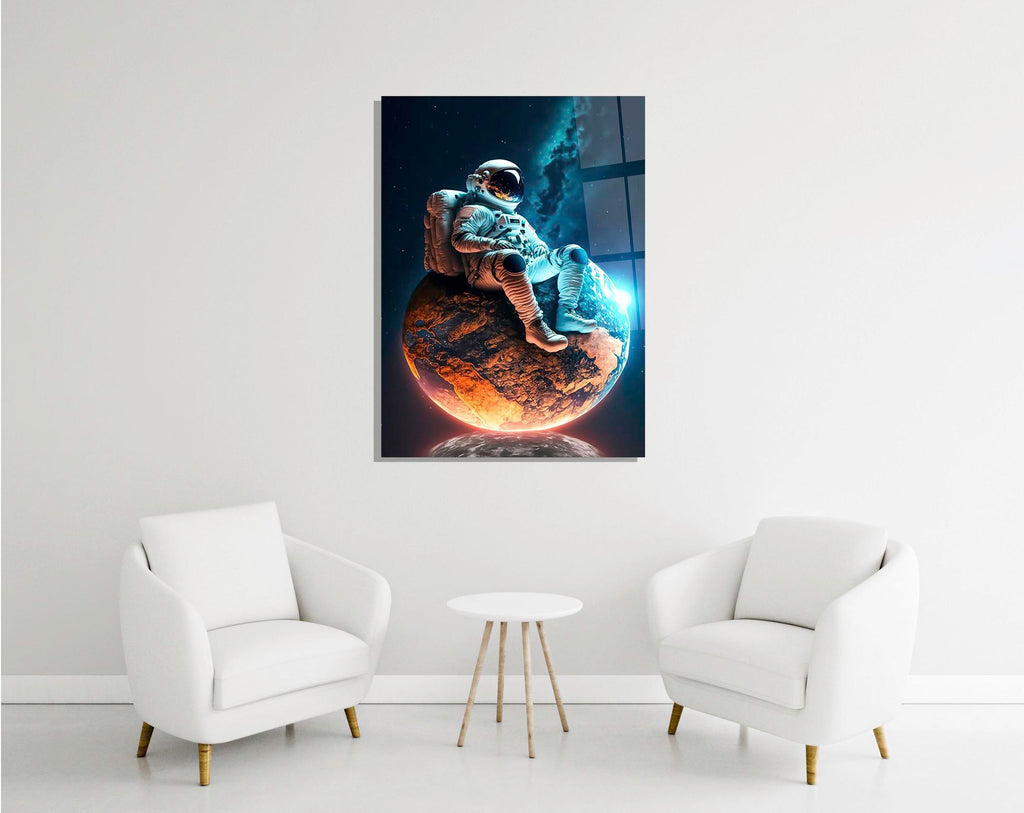 Astronaut Resting on a Glowing Planet Glass Wall Art in a modern interior