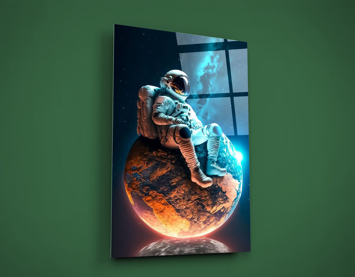 Astronaut Resting on a Glowing Planet Glass Wall Art on the wall