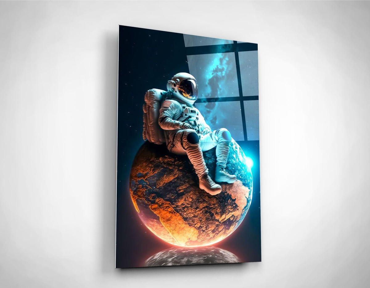 Astronaut Resting on a Glowing Planet Glass Wall Art close-up
