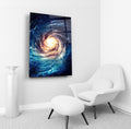 Spiral Galaxy Blue and Gold Glass Wall Art in a living room interior