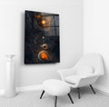 Cosmic Orange Planets Abstract Glass Wall Art in a living room interior