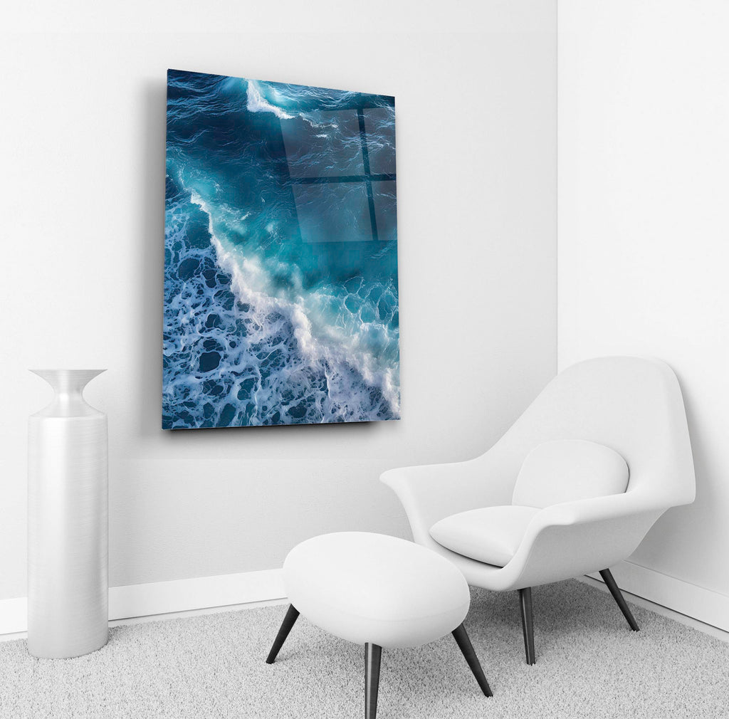Turquoise Ocean Wave Aerial Glass Wall Art in a living room interior