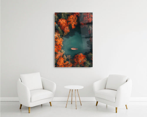 Aerial Autumn Lake with Rowboat Glass Wall Art in a modern interior