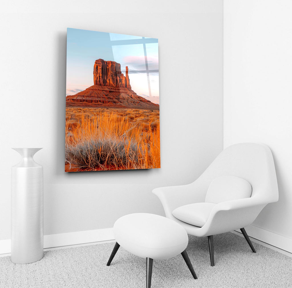 Desert Butte at Sunset Glass Wall Art in a living room interior