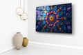 Vibrant Blue and Orange Mandala Glass Wall Art in a living room interior
