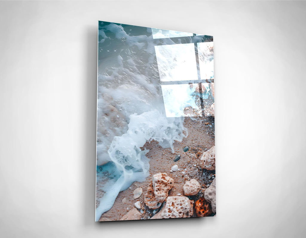 Sea Foam on a Pebble Beach Glass Wall Art on the wall