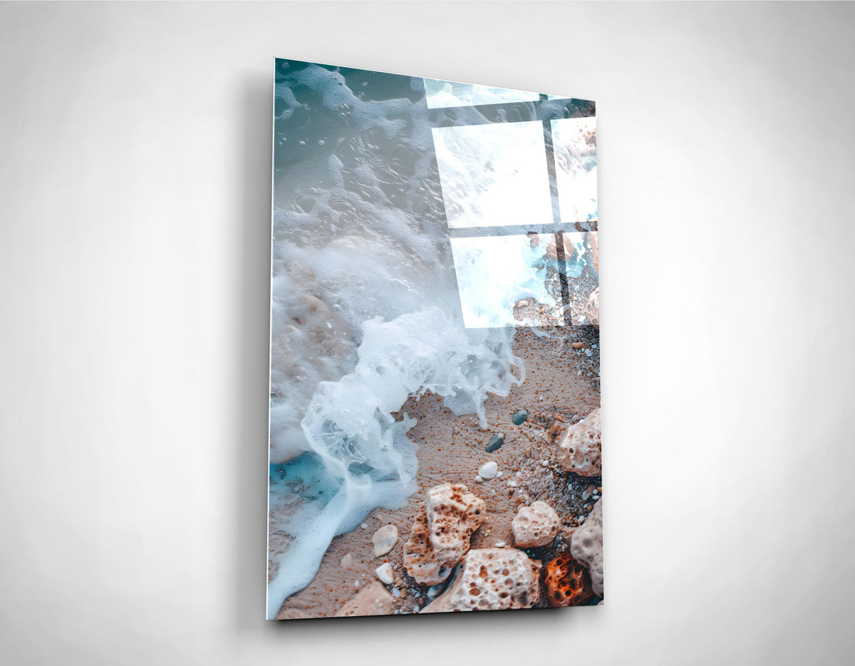 Sea Foam on a Pebble Beach Glass Wall Art on the wall