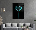 Teal Glass Heart on Black Glass Wall Art in a living room interior
