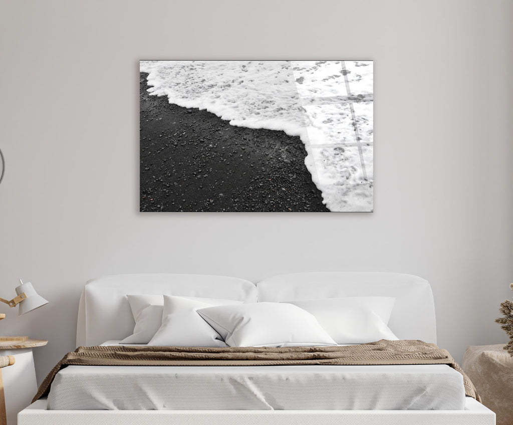Black Sand Beach Waves Glass Wall Art in a living room interior