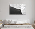 Black Sand Beach Waves Glass Wall Art in a living room interior