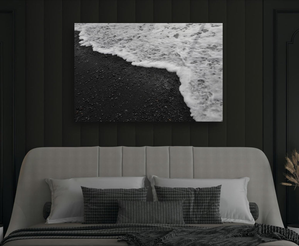 Black Sand Beach Waves Glass Wall Art in a modern interior