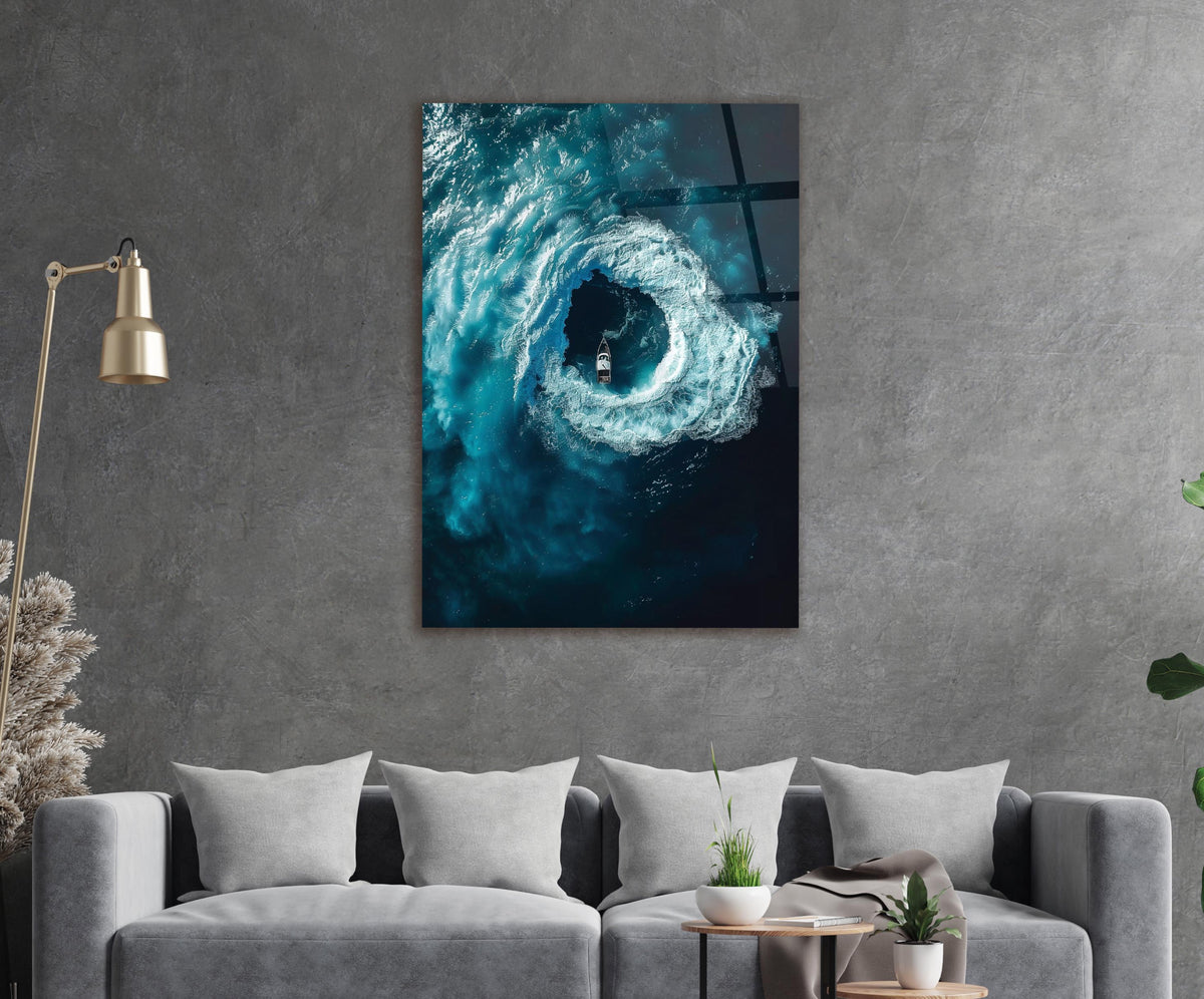 Ocean Whirlpool Boat Aerial Glass Wall Art in a living room interior