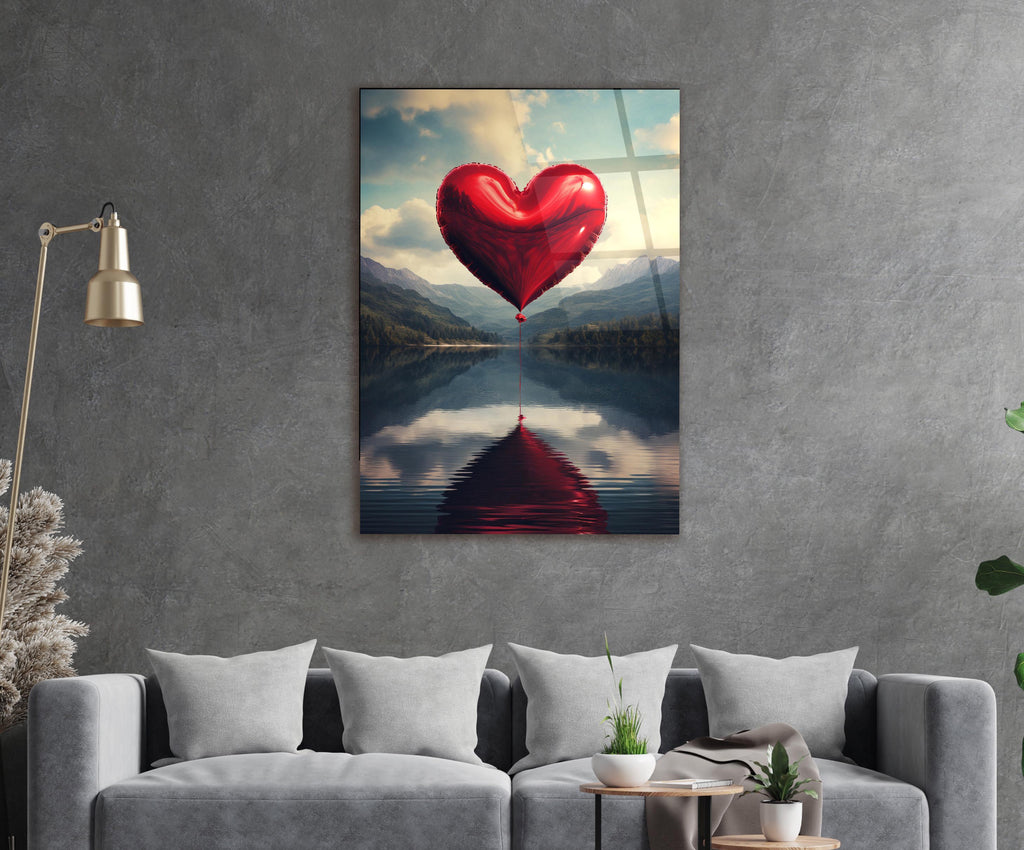 Red Heart Balloon Over Mountain Lake Glass Wall Art in a living room interior