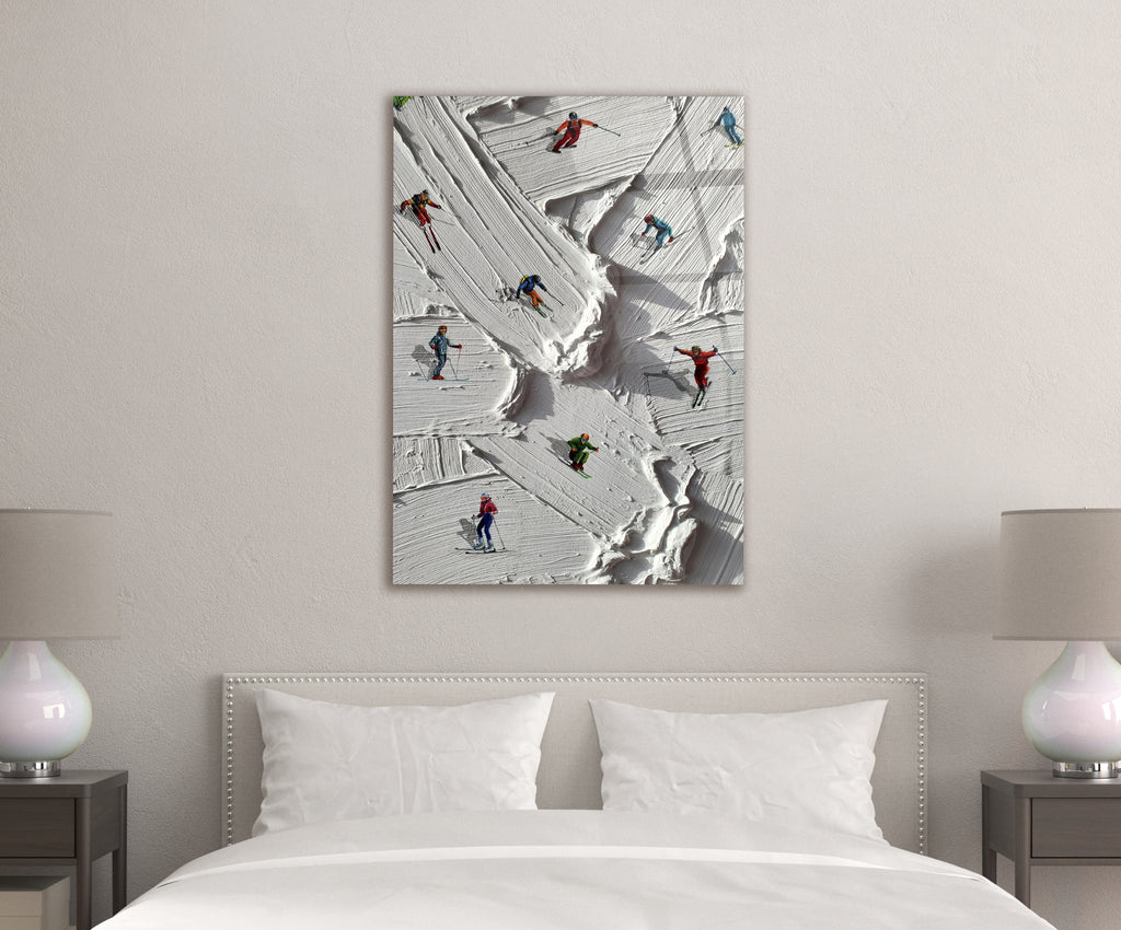 Miniature Skiers on Snowy Slope Glass Wall Art in a living room interior