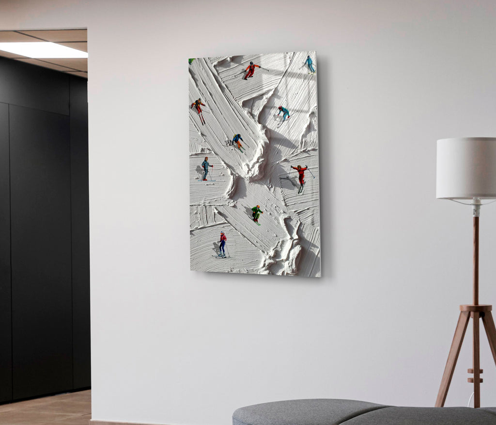 Miniature Skiers on Snowy Slope Glass Wall Art in a modern interior