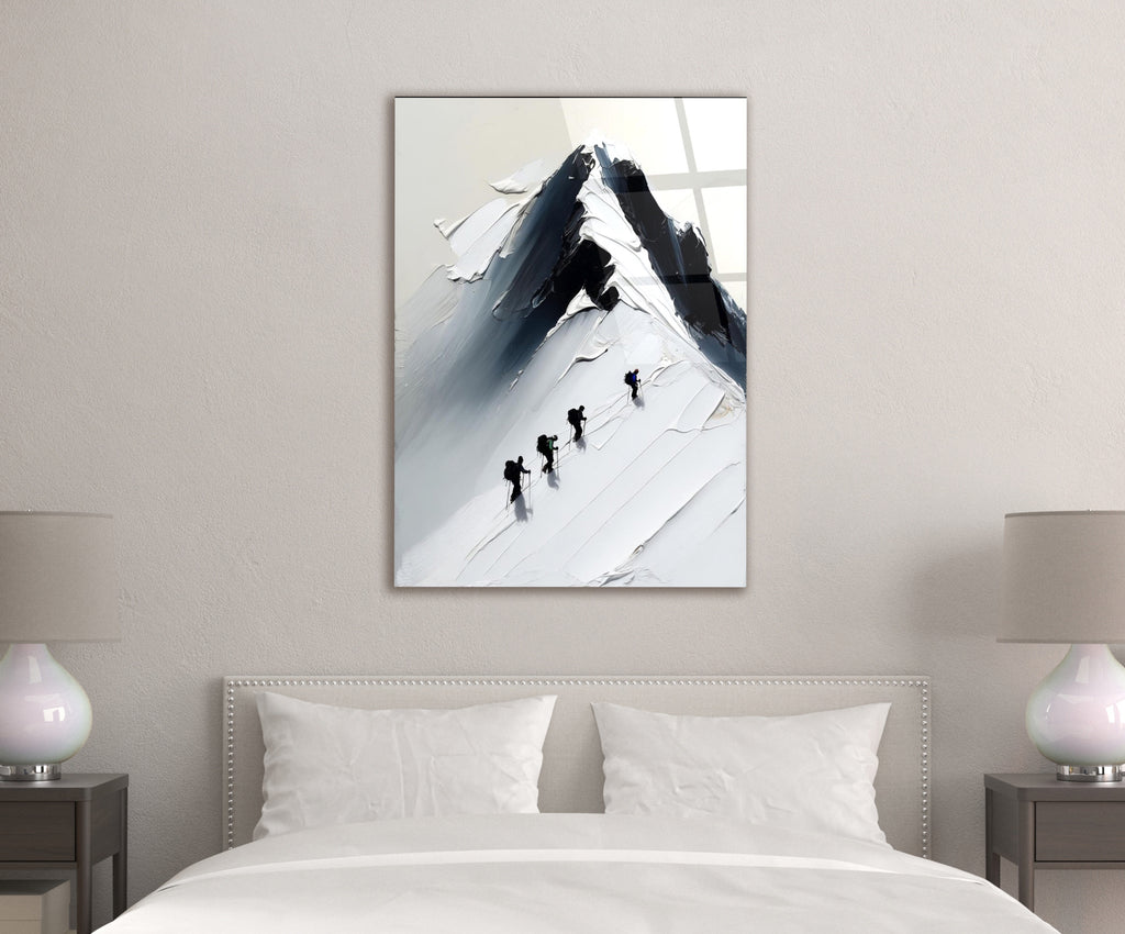Climbers on a Snowy Mountain Peak Glass Wall Art in a modern interior