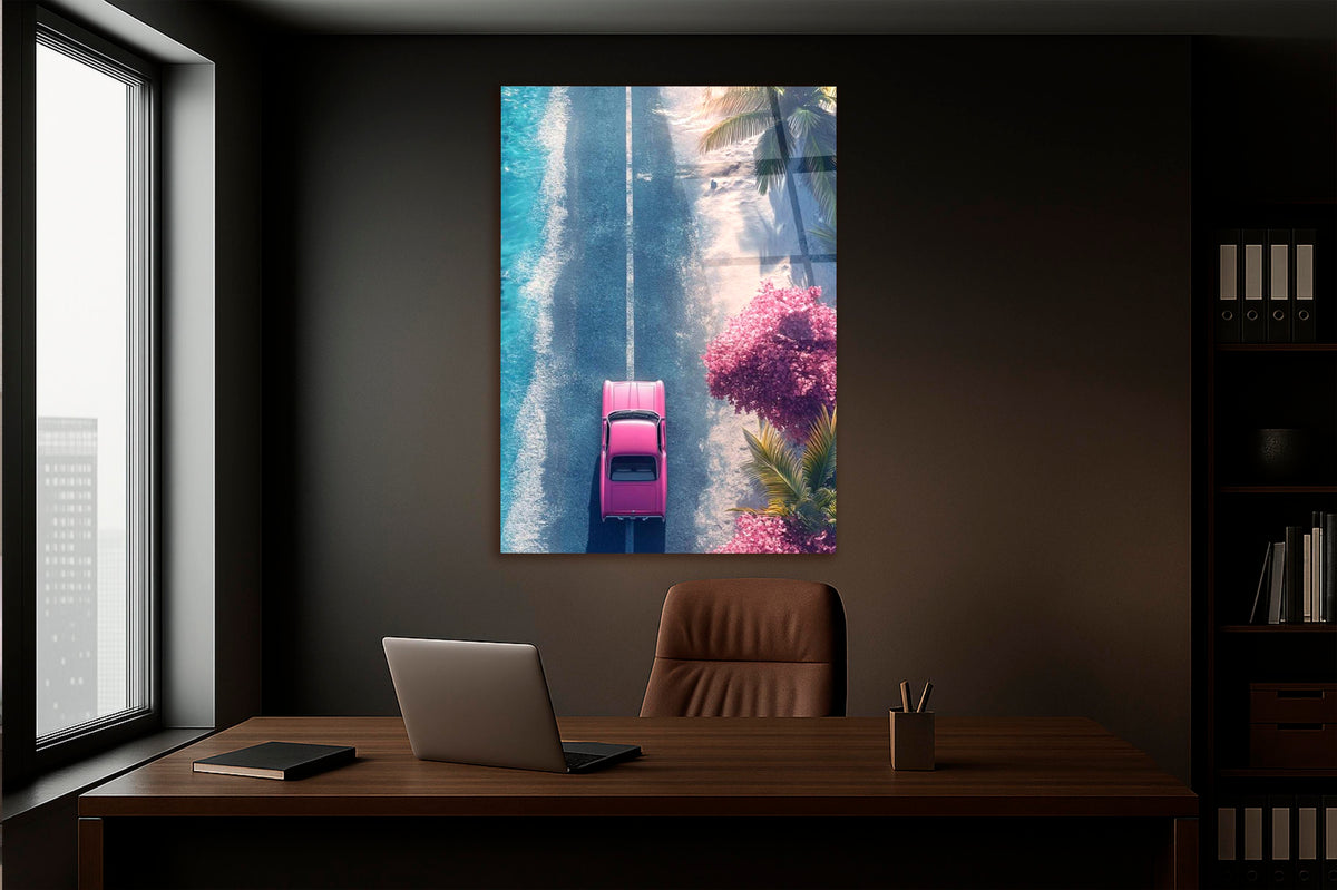 Pink Classic Car Coastal Road Aerial Glass Wall Art in a living room interior