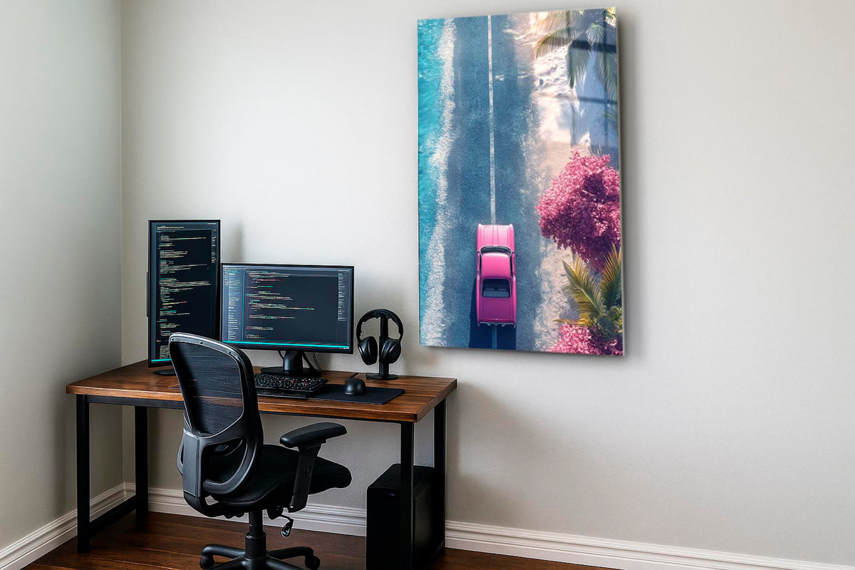 Pink Classic Car Coastal Road Aerial Glass Wall Art on the wall