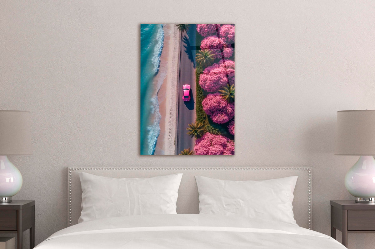 Pink Car on Blossom Beach Road Aerial Glass Wall Art in a modern interior