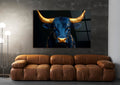 Navy Bull With Golden Horns Glass Wall Art in a living room interior