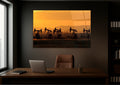 Oil Pumpjacks at Sunset Glass Wall Art in a living room interior