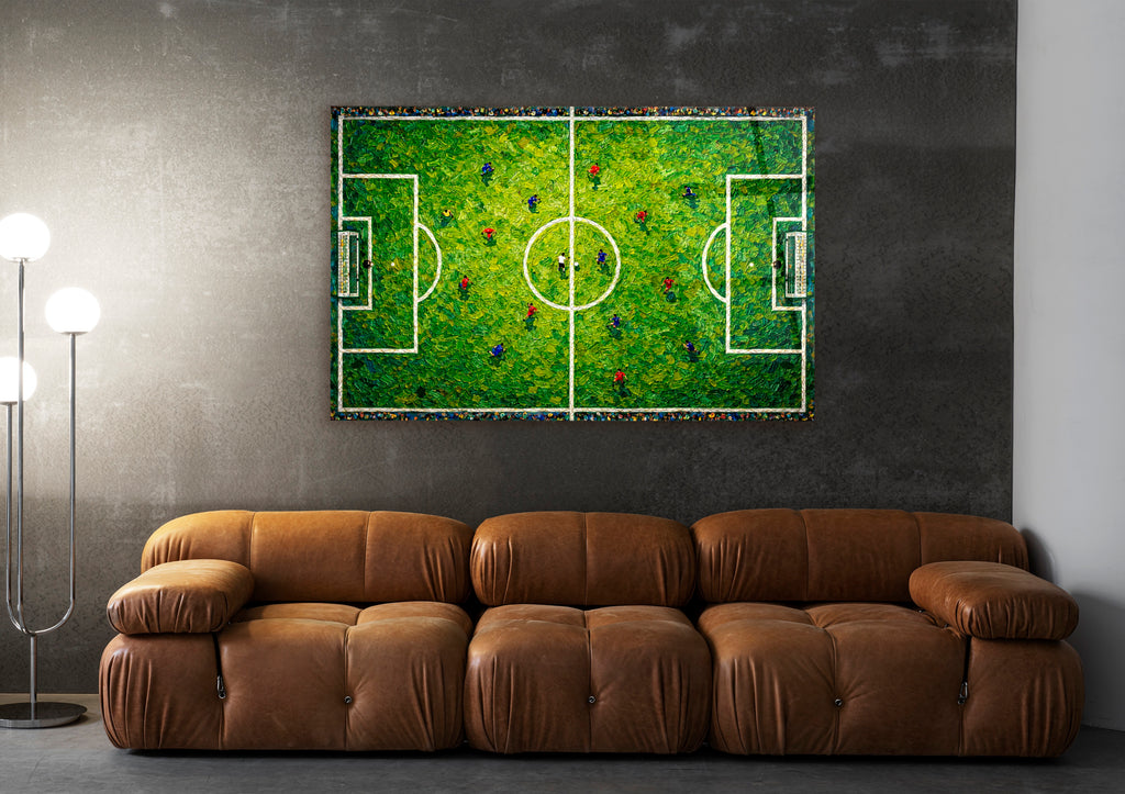 Aerial Soccer Pitch Impasto Glass Wall Art in a living room interior