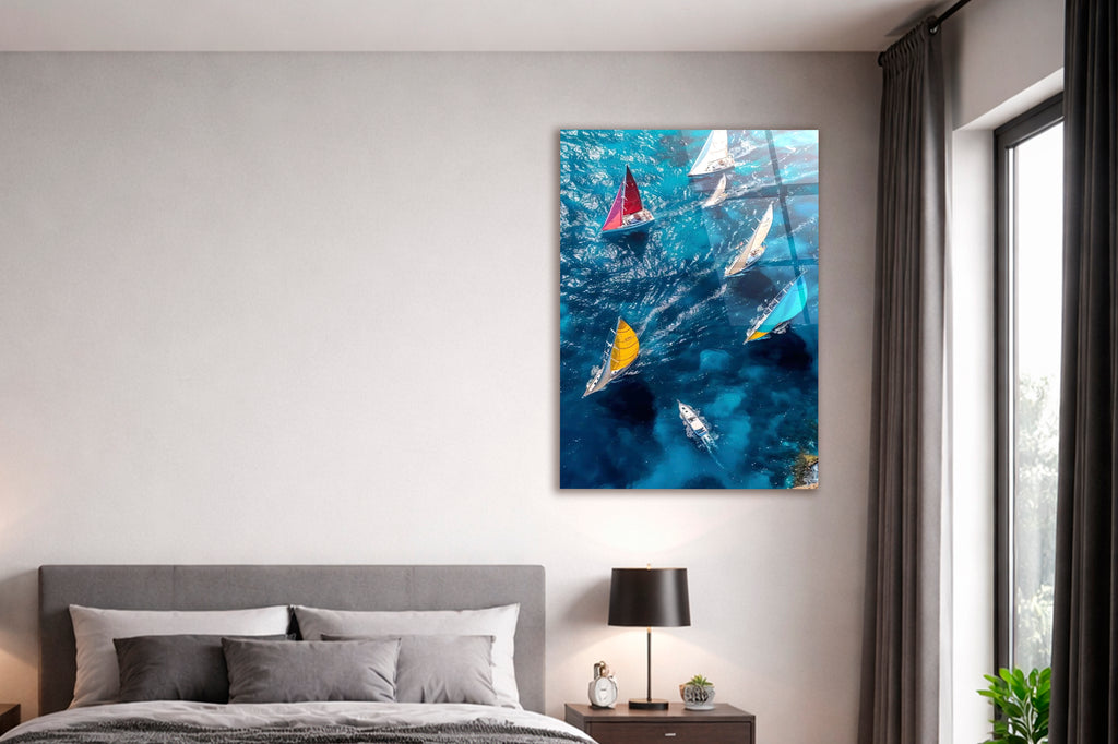 Sailboats on Blue Sea Aerial Glass Wall Art in a living room interior