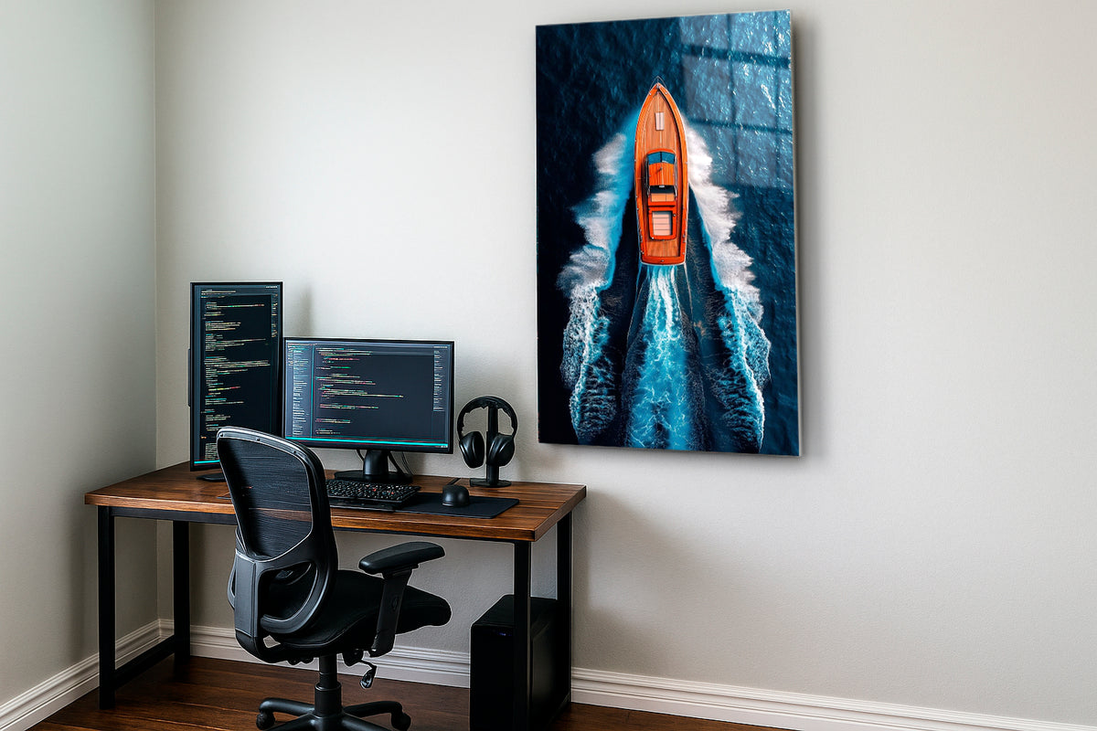Orange Speedboat Aerial Ocean Glass Wall Art on the wall