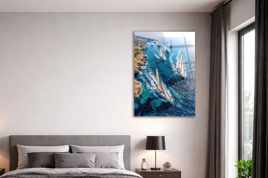 Sailboat Regatta Along the Coast Glass Wall Art in a living room interior