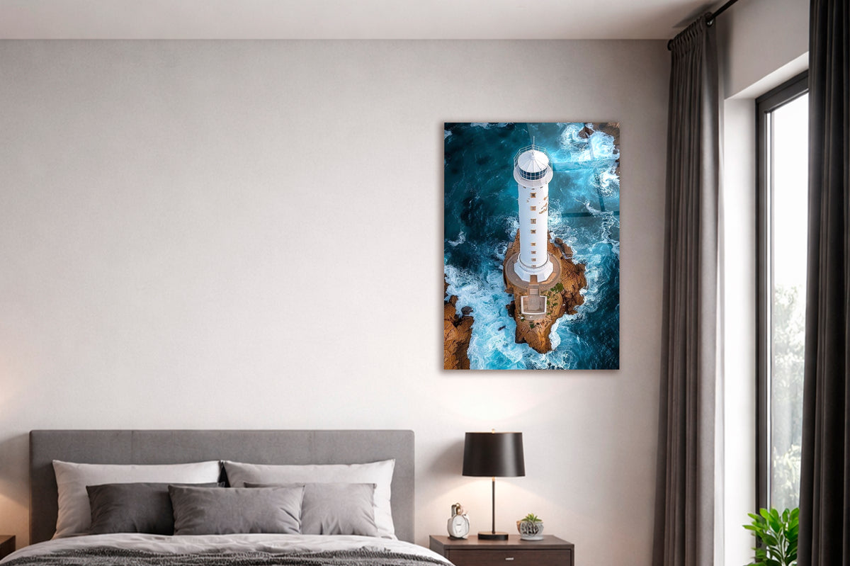 Aerial Lighthouse Ocean Waves Glass Wall Art in a modern interior