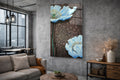 Pale Blue Poppies on Bronze Glass Wall Art in a living room interior