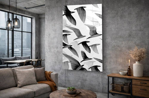 Black and White Flying Birds Glass Wall Art in a living room interior