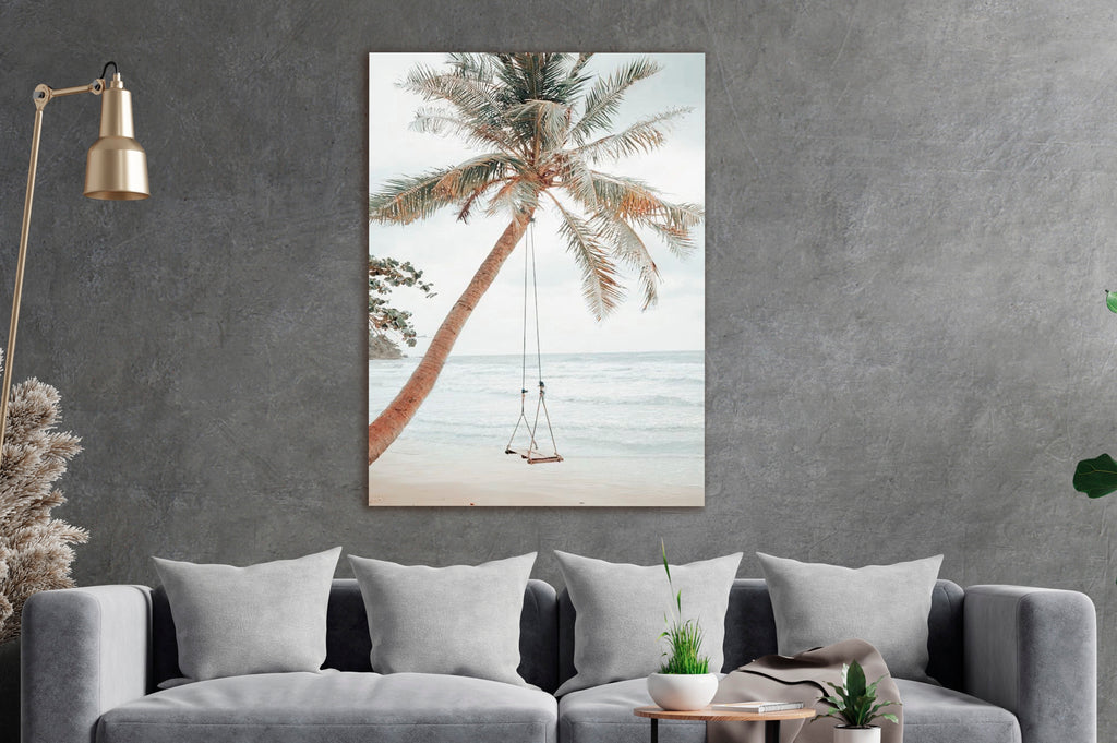 Palm Tree Beach Swing Glass Wall Art in a living room interior