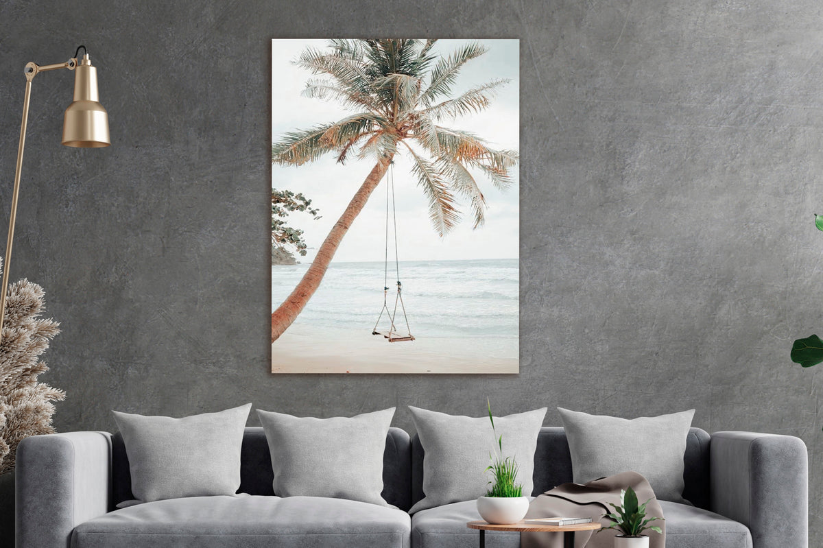 Palm Tree Beach Swing Glass Wall Art in a living room interior