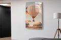Hot Air Balloon in Peach Clouds Glass Wall Art in a living room interior