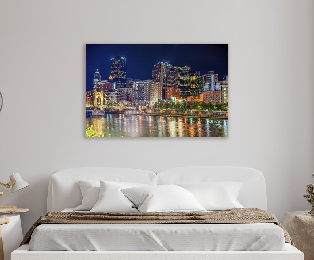 Pittsburgh Skyline Night River Reflections Glass Wall Art in a living room interior